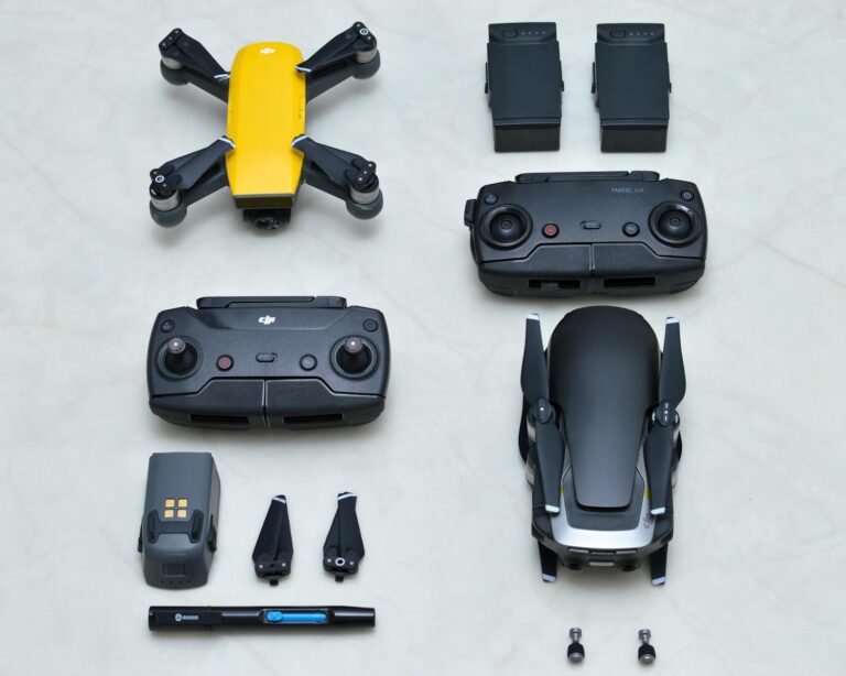 Top view of drones, controllers, and accessories neatly arranged on a surface.