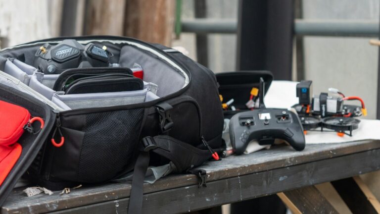 a back pack sitting on top of a wooden table