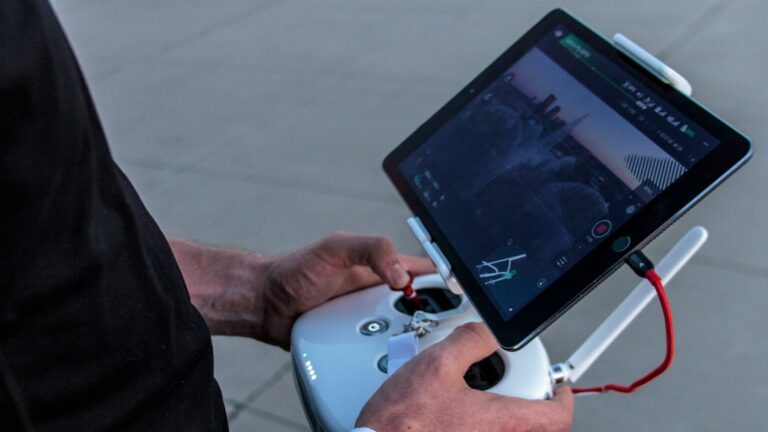 person holding quadcopter controller