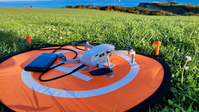 a remote controlled flying device on a field of grass